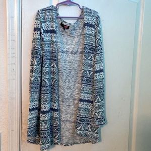 Blue, patterned sweater/cardigan.